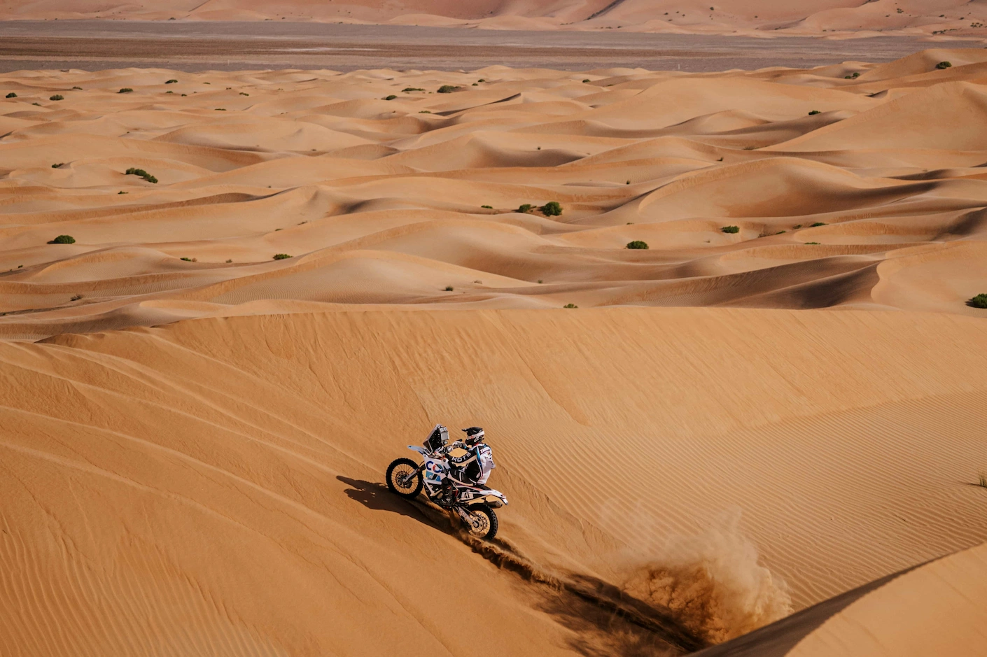 Enduro riding in the dunes. Sahara desert landscape.